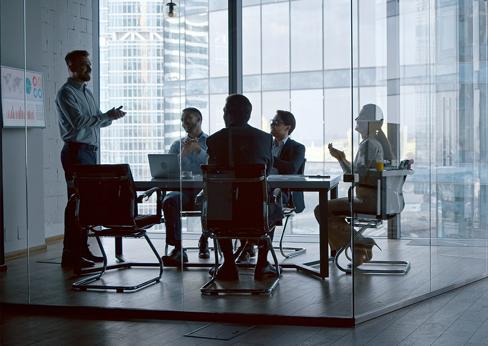 Team meeting with business professionals collaborating around a table